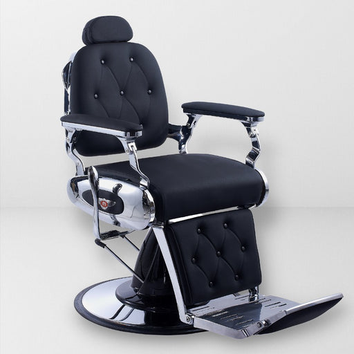 Transitional barber chair. Upholstered in black vegan smooth leather. Diamond tufted stitch. Padded arms and Chrome base.