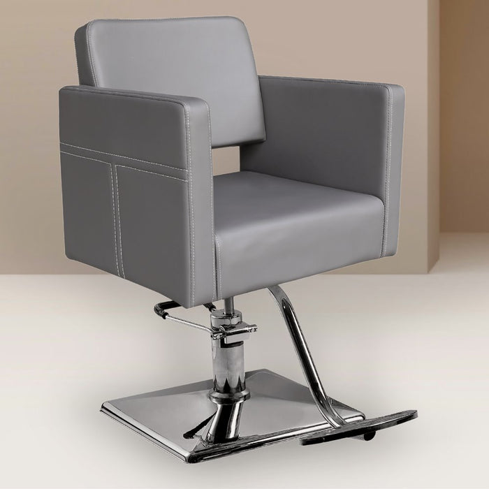 grey vegan leather styling chair. Stylist chair with square chrome base and upholstered arms with contrast stitching. Greige color