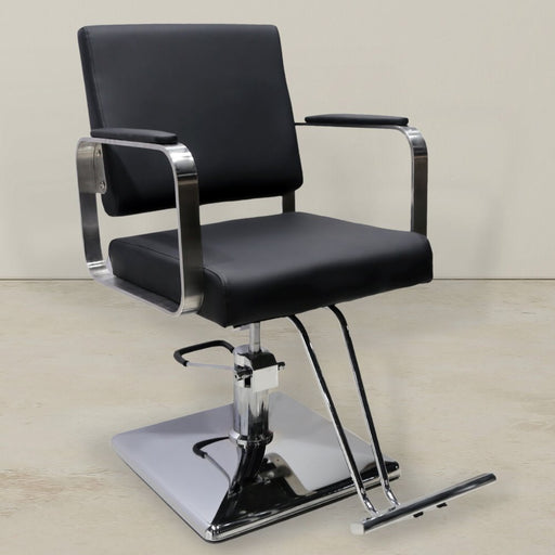 Black vegan leather styling chair. Stylist chair with square chrome base and chrome arms